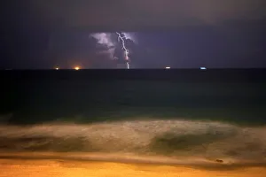 Lightning strikes over the Mediterranean sea during a rain storm near the city of Lightning strikes over the Mediterranean sea during a rain storm near the city of