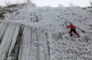 Images Dated 23rd January 2016: A man climbs an artificial wall of ice in the city of Liberec