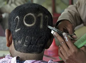 A man gets a haircut depicting 2011 to welcome the new year at a barbershop in the A man gets a haircut depicting 2011 to welcome the new year at a barbershop in the