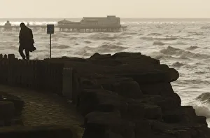 A man watches Storm Gertrude whips up the Irish sea off Blackpool as it crosses over A man watches Storm Gertrude whips up the Irish sea off Blackpool as it crosses over