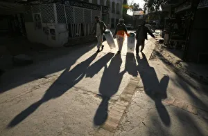 Men carry ballot boxes to a polling station in Rawalpindi Men carry ballot boxes to a polling station in Rawalpindi