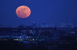 The moon rises over east London The moon rises over east London