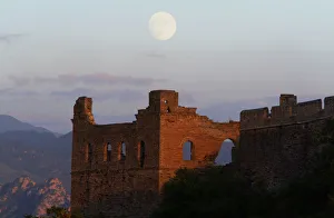 THE MOON RISES BEHIND A GUARD TOWER ON THE JIN SHAN SECTION OF THE GREAT WALL THE MOON RISES BEHIND A GUARD TOWER ON THE JIN SHAN SECTION OF THE GREAT WALL