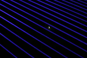 The moon is seen during the beginning of a total lunar eclipse through the structures of The moon is seen during the beginning of a total lunar eclipse through the structures of