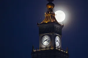 The moon is seen above the Palace of Culture and Science in the center of Warsaw The moon is seen above the Palace of Culture and Science in the center of Warsaw