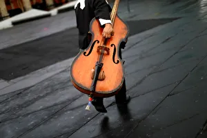 A musician holds a double bass at Garibaldi square in Mexico City A musician holds a double bass at Garibaldi square in Mexico City