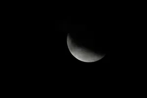 Prints of A partial lunar eclipse is seen in Karachi, Pakistan July 17, 2019. REUTERS/Akhtar Soomro Eclipse Prints: Partial Lunar Eclipse Print, Karachi, Pakistan July 17 2019