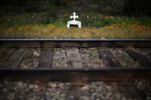 Prints of An Animita which is used to remember a tragic event in a public place, is seen next to a train track which is used to transport garbage in Til Til, Chile, October 5, 2017 Chile Prints: The Wider Image: Chiles tiny Til Til faces big trash problem Print