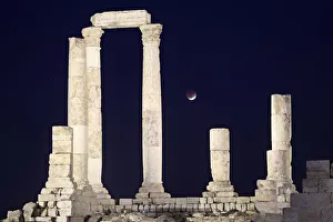 A partial lunar eclipse is seen from the Roman pillars of the Temple of Hercules in Amman A partial lunar eclipse is seen from the Roman pillars of the Temple of Hercules in Amman