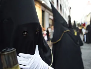 A penitent waits for the start of a procession in Tenerife in Spains Canary Islands A penitent waits for the start of a procession in Tenerife in Spains Canary Islands