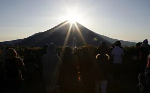People admire the moment the sun rises just above Mt. Fuji in Fujikawaguchiko People admire the moment the sun rises just above Mt. Fuji in Fujikawaguchiko