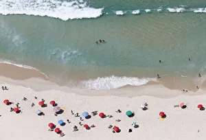 People enjoy the Barra da Tijuca beach in Rio de Janeiro People enjoy the Barra da Tijuca beach in Rio de Janeiro