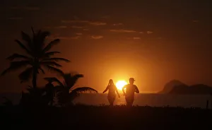 People exercise in Barra da Tijuca beach during the sunrise in Rio de Janeiro People exercise in Barra da Tijuca beach during the sunrise in Rio de Janeiro
