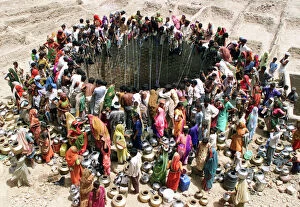 Images Dated 1st June 2003: People Gather Around a Well