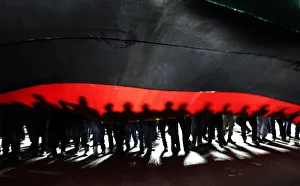 People hold a giant Libyan flag during a march to Martyrs Square in Tripoli People hold a giant Libyan flag during a march to Martyrs Square in Tripoli