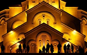 Images Dated 7th January 2018: People walk in front of the Holy Trinity cathedral a midnight Christmas service in