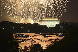 People watch from boats on the Potomac River as Independence Day fireworks light the sky People watch from boats on the Potomac River as Independence Day fireworks light the sky