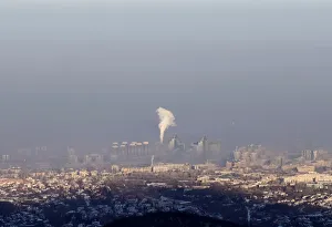 A power station is seen through smog covering Almaty A power station is seen through smog covering Almaty