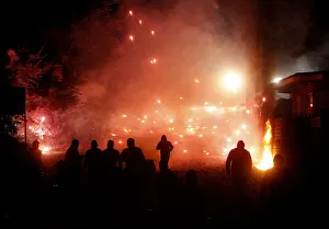 Protesters throw firecrackers during violent overnight protests against the opening of a Protesters throw firecrackers during violent overnight protests against the opening of a