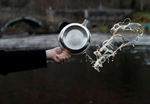 Images Dated 15th January 2018: A Quaich of whisky is thrown in the river to bless the river on the opening day of the