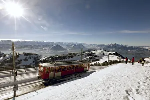 A rack railcar of Rigi Bahn railways leaves the peak of Mount Rigi near Lake Lucerne A rack railcar of Rigi Bahn railways leaves the peak of Mount Rigi near Lake Lucerne