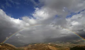 A rainbow stretches over Mount Haramoun as seen from the southern Lebanese village A rainbow stretches over Mount Haramoun as seen from the southern Lebanese village