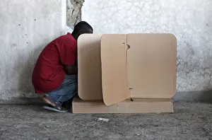 A resident marks his ballot in a poll center during presidential elections in A resident marks his ballot in a poll center during presidential elections in