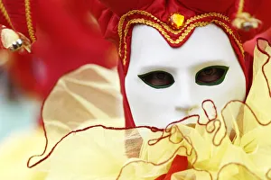 A reveller participates in a masked ball during celebrations for the Carnival of A reveller participates in a masked ball during celebrations for the Carnival of