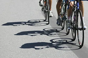Riders shadows are projected on the road during the fourth stage of the Tour de Suisse Riders shadows are projected on the road during the fourth stage of the Tour de Suisse
