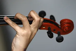 A Roma child plays the violin during a lesson organised by the Hungarian Talentum A Roma child plays the violin during a lesson organised by the Hungarian Talentum