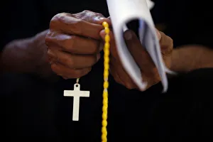A Roman Catholic worshipper prays at a church during Holy Week in Larantuka on Flores A Roman Catholic worshipper prays at a church during Holy Week in Larantuka on Flores