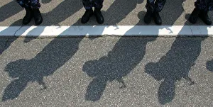 Romanian gendarmes cast shadows during a swearing-in ceremony in Bucharest Romanian gendarmes cast shadows during a swearing-in ceremony in Bucharest