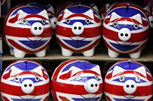 Row of piggy banks adorned with the colours of Britains Union Jack flag are seen in a Row of piggy banks adorned with the colours of Britains Union Jack flag are seen in a