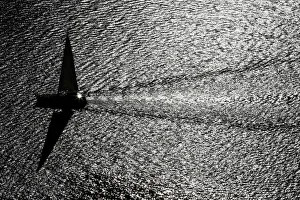 A sailing boat is pictured on the Lake Leman during a warm autumn day in Chexbres A sailing boat is pictured on the Lake Leman during a warm autumn day in Chexbres