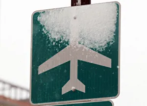 Snow covers a sign marking the route to Logan Airport during a snowstorm in Boston Snow covers a sign marking the route to Logan Airport during a snowstorm in Boston