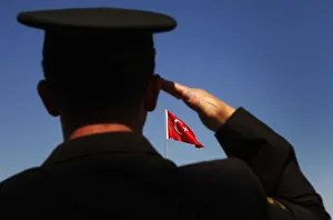 A soldier salutes the Turkish flag during a parade to mark the 88th anniversary of A soldier salutes the Turkish flag during a parade to mark the 88th anniversary of