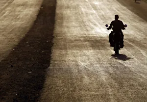 A southern Sudanese man rides a motorcycle during sunset in Juba A southern Sudanese man rides a motorcycle during sunset in Juba