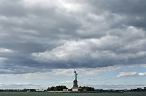 The Statue of Liberty can be seen underneath cloud cover in New York The Statue of Liberty can be seen underneath cloud cover in New York