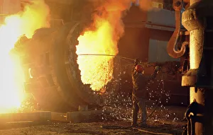 A steel worker operates a furnace at a steel manufacturing plant in Hefei A steel worker operates a furnace at a steel manufacturing plant in Hefei