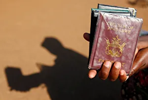 A street vendor offers passport covers for sale outside a Home Affairs Department office A street vendor offers passport covers for sale outside a Home Affairs Department office