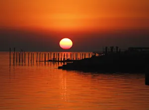 The sun rises over the banks of the Rio de La Plata, in Buenos Aires The sun rises over the banks of the Rio de La Plata, in Buenos Aires