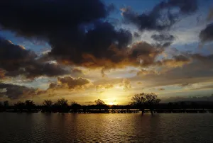 The sun rises over flooded fields at Pulborough The sun rises over flooded fields at Pulborough