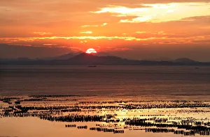 The sun sets over Chinas southeastern coast of Fujian as seen from Taiwans frontline The sun sets over Chinas southeastern coast of Fujian as seen from Taiwans frontline