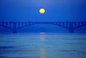 The sun sets above Yenisei river in the Siberian city of Krasnoyarsk The sun sets above Yenisei river in the Siberian city of Krasnoyarsk