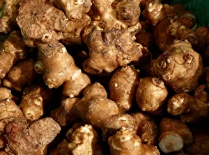 Sunchokes, also known as Jerusalem artichokes, are seen in vegetable crates at the Sunchokes, also known as Jerusalem artichokes, are seen in vegetable crates at the