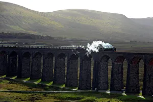 The Tornado Steam Locomotive crosses Ribblehead viaduct in northern England The Tornado Steam Locomotive crosses Ribblehead viaduct in northern England
