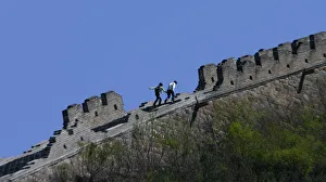 Tourist walk on a part of the Huanghuacheng section of Chinas Great Wall, northwest Tourist walk on a part of the Huanghuacheng section of Chinas Great Wall, northwest