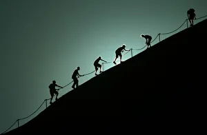 TOURISTS CLIMB AYERS ROCK IN CENTRAL AUSTRALIA TOURISTS CLIMB AYERS ROCK IN CENTRAL AUSTRALIA