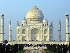Tourists stand in front of the historic Taj Mahal in Agra Tourists stand in front of the historic Taj Mahal in Agra