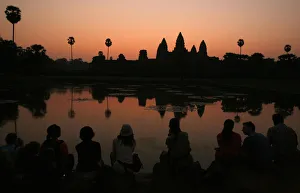 Tourists wait for the sun to rise over Angkor Wat in Siem Reap Tourists wait for the sun to rise over Angkor Wat in Siem Reap